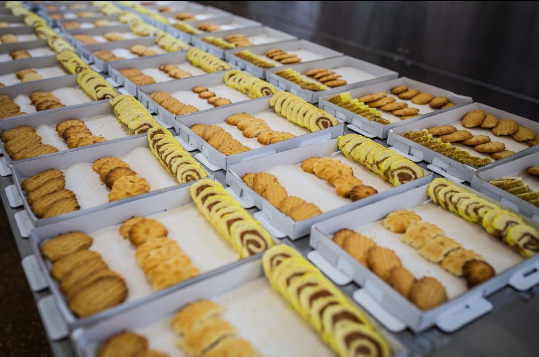 Baked goods moving through a production line, the process a flavor has to survive